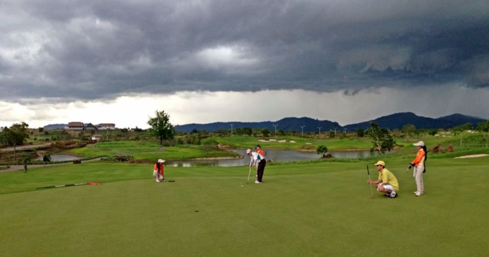 Putting in Hole 6 with Dark Clouds Hanging in the Background