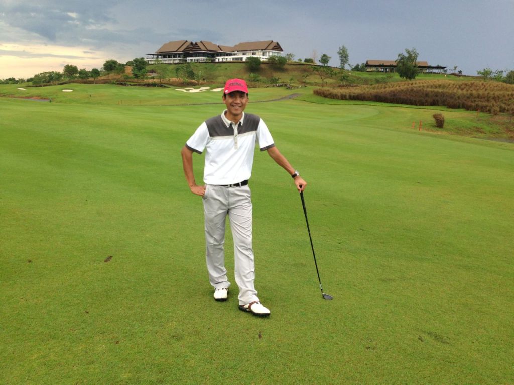 I was Happily Posed in Hole 9 of Padi Valley, After the Rain, with Club House in Background. 