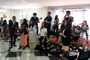 Aya is playing bass for her class band. What a surprise! :)